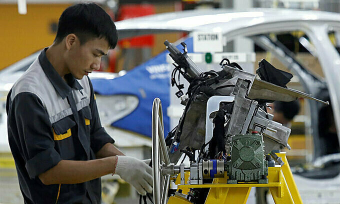 A man works at an assembly line of an auto factory in Hai Phong City, northern Vietnam.