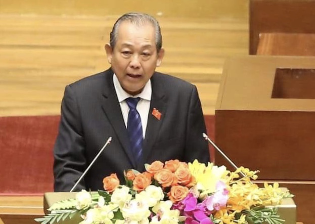 Phó Thủ tướng Thường trực Trương Hòa Bình trình bày báo cáo trước Quốc hội.